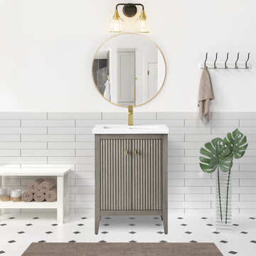 VanityArt 24-inch gray reeded bathroom vanity with double doors, white ceramic sink, brushed gold faucet, lifestyle setting