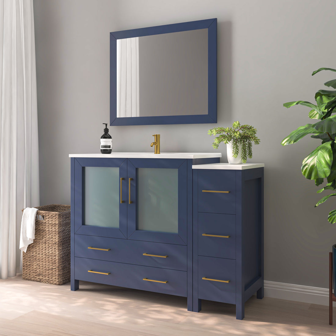VanityArt 48-inch navy blue single sink vanity with right-side storage tower, frosted glass doors, and framed mirror