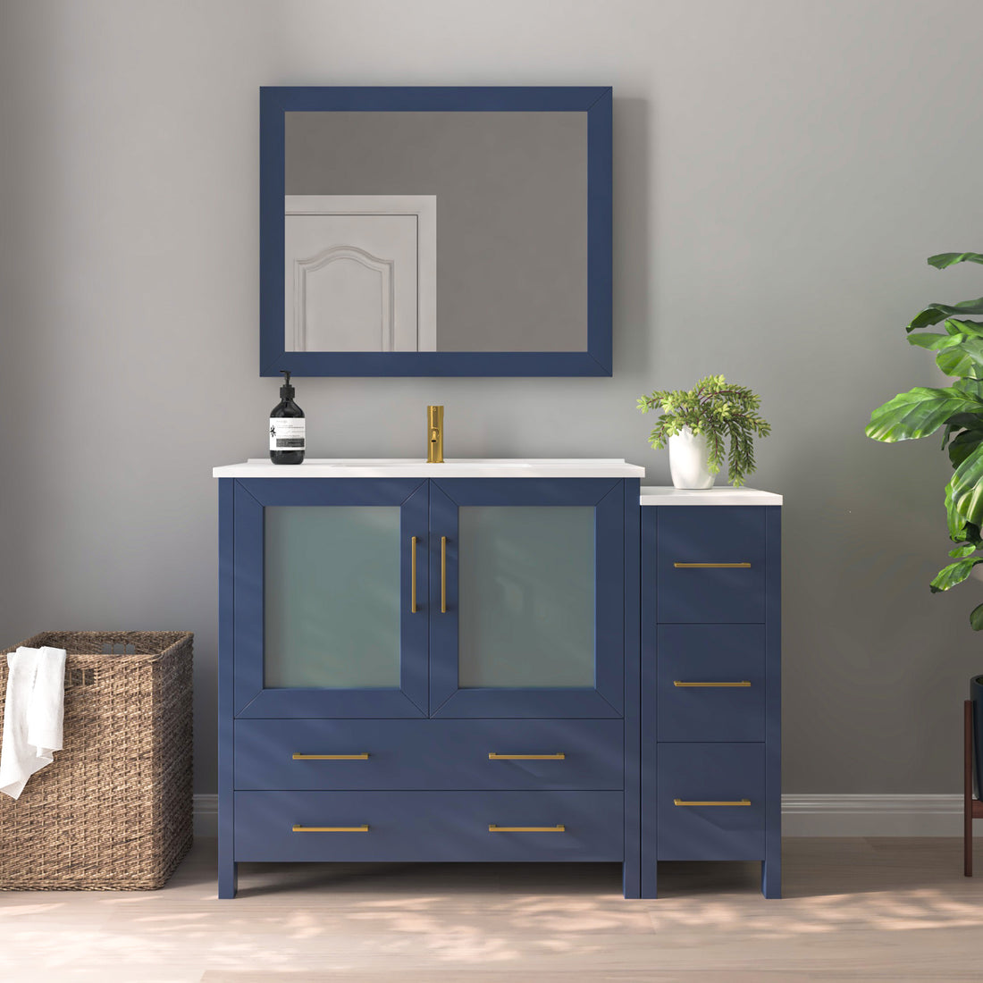 VanityArt 48-inch navy blue single sink vanity with right-side storage tower, frosted glass doors, and framed mirror