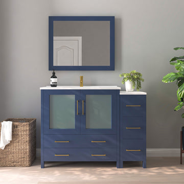 VanityArt 48-inch navy blue single sink vanity with right-side storage tower, frosted glass doors, and framed mirror