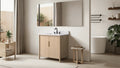 VanityArt 36-inch light oak single-door bathroom vanity with white stone top and black faucet, angled view in spa bathroom