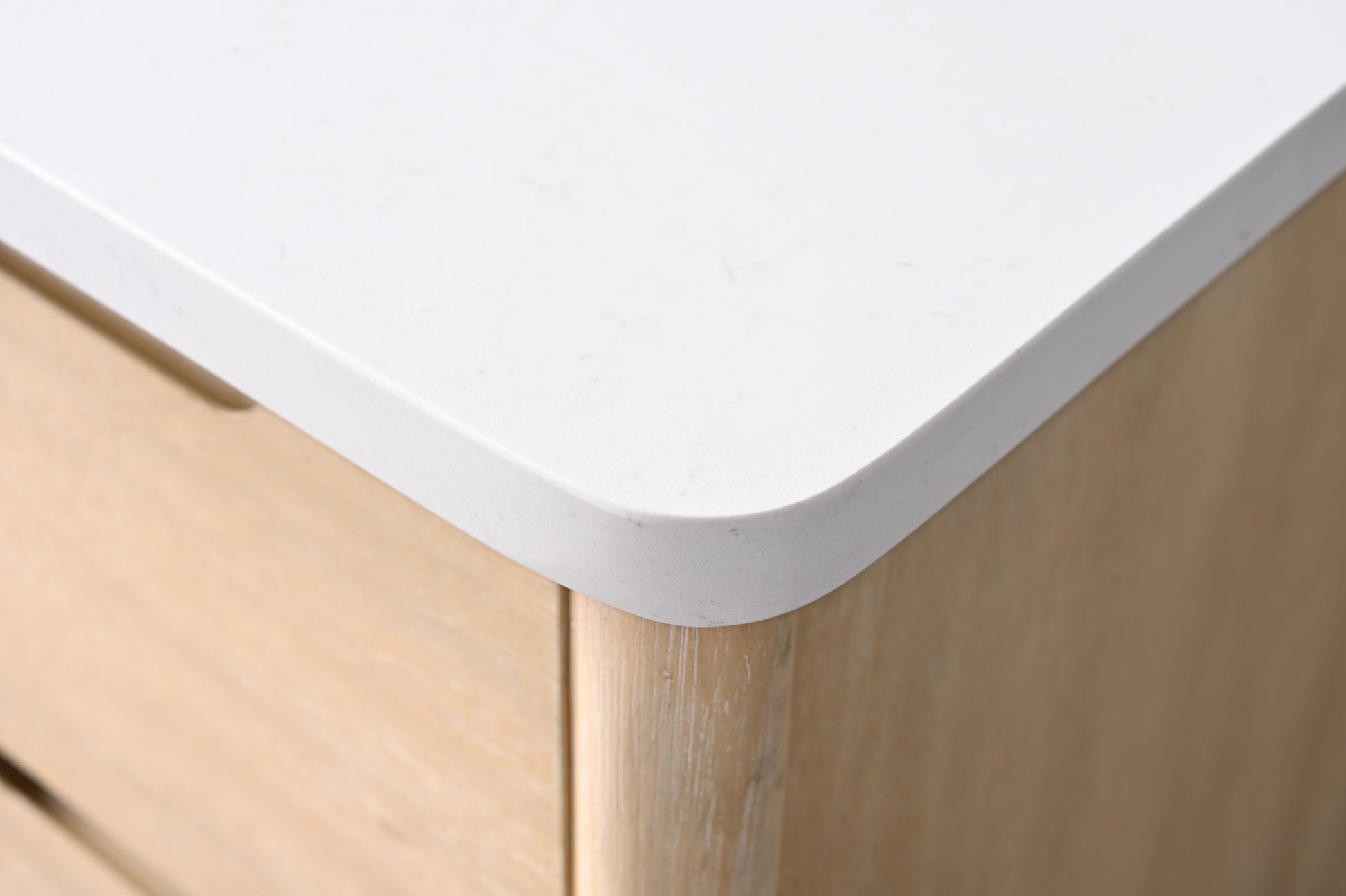 Close-up of VanityArt vanity white engineered stone countertop corner showing subtle texture and rounded edge detail
