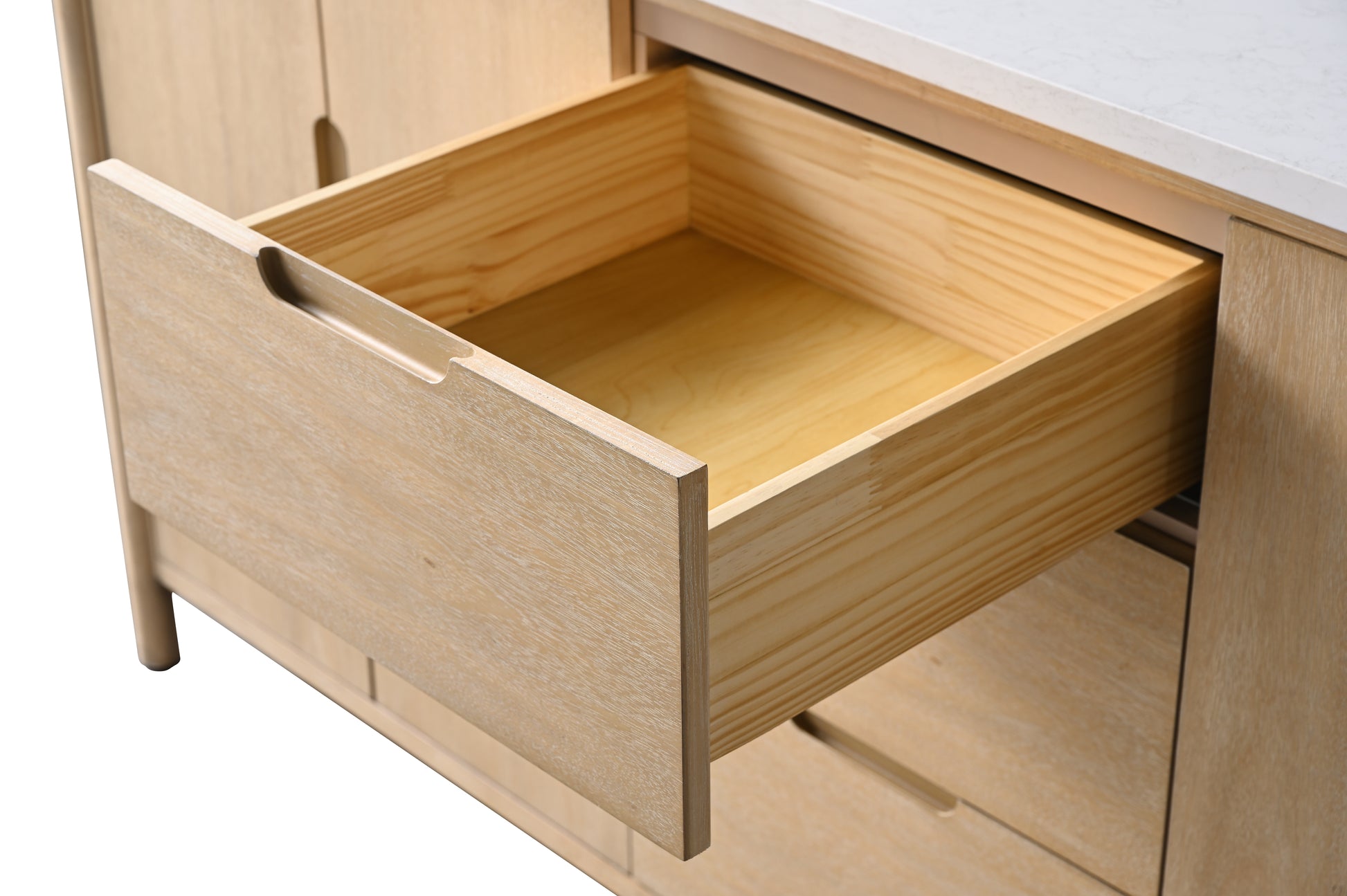 Front-angle close-up of fully extended light oak vanity drawer showing deep wood interior