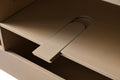 Close-up of integrated power outlet panel inside light oak bathroom vanity cabinet interior
