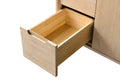 Single open wood drawer pull-out detail on light oak bathroom vanity, close-up front view