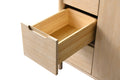 Open wood drawer interior detail showing dovetail construction on light oak bathroom vanity, angled view