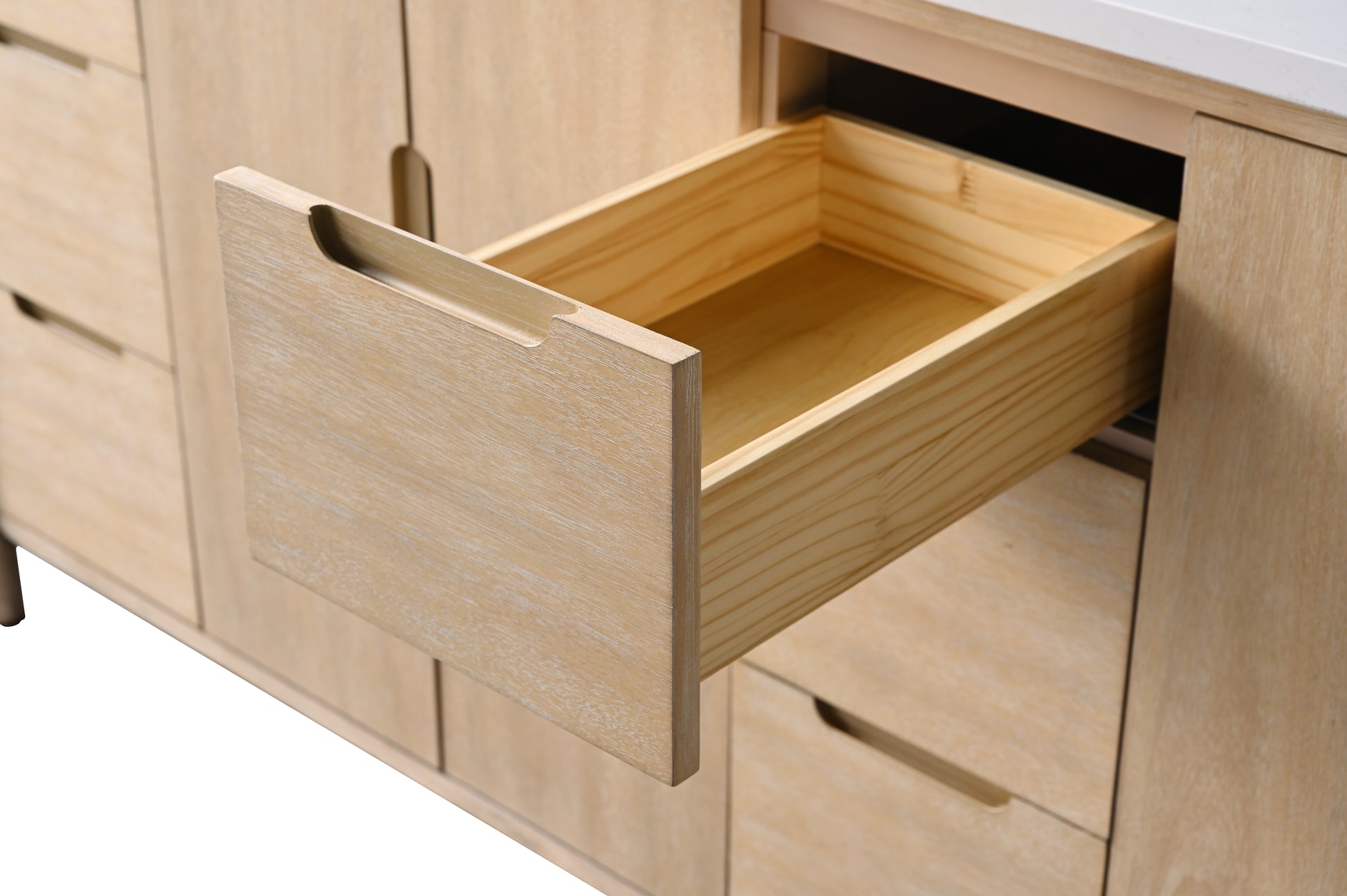 Open drawer on right side of light oak bathroom vanity showing solid wood construction and recessed handle