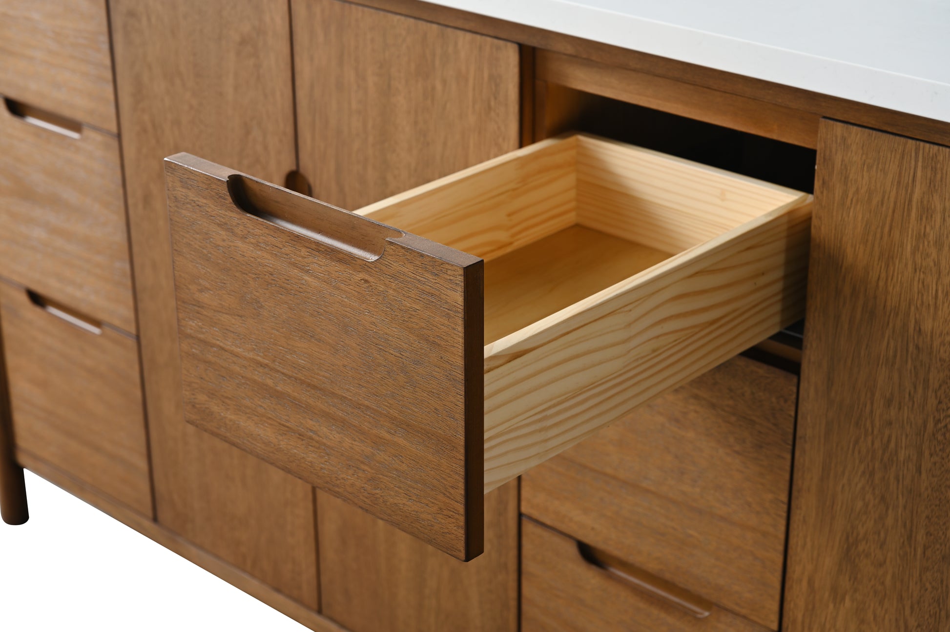 Center open drawer detail of walnut vanity showing pine interior with dovetail joints and pull handle