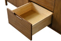 Close-up of open dovetail wood drawer interior on walnut bathroom vanity