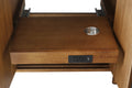 Close-up of pull-out electrical drawer tray with power outlets USB port and cable grommet hole