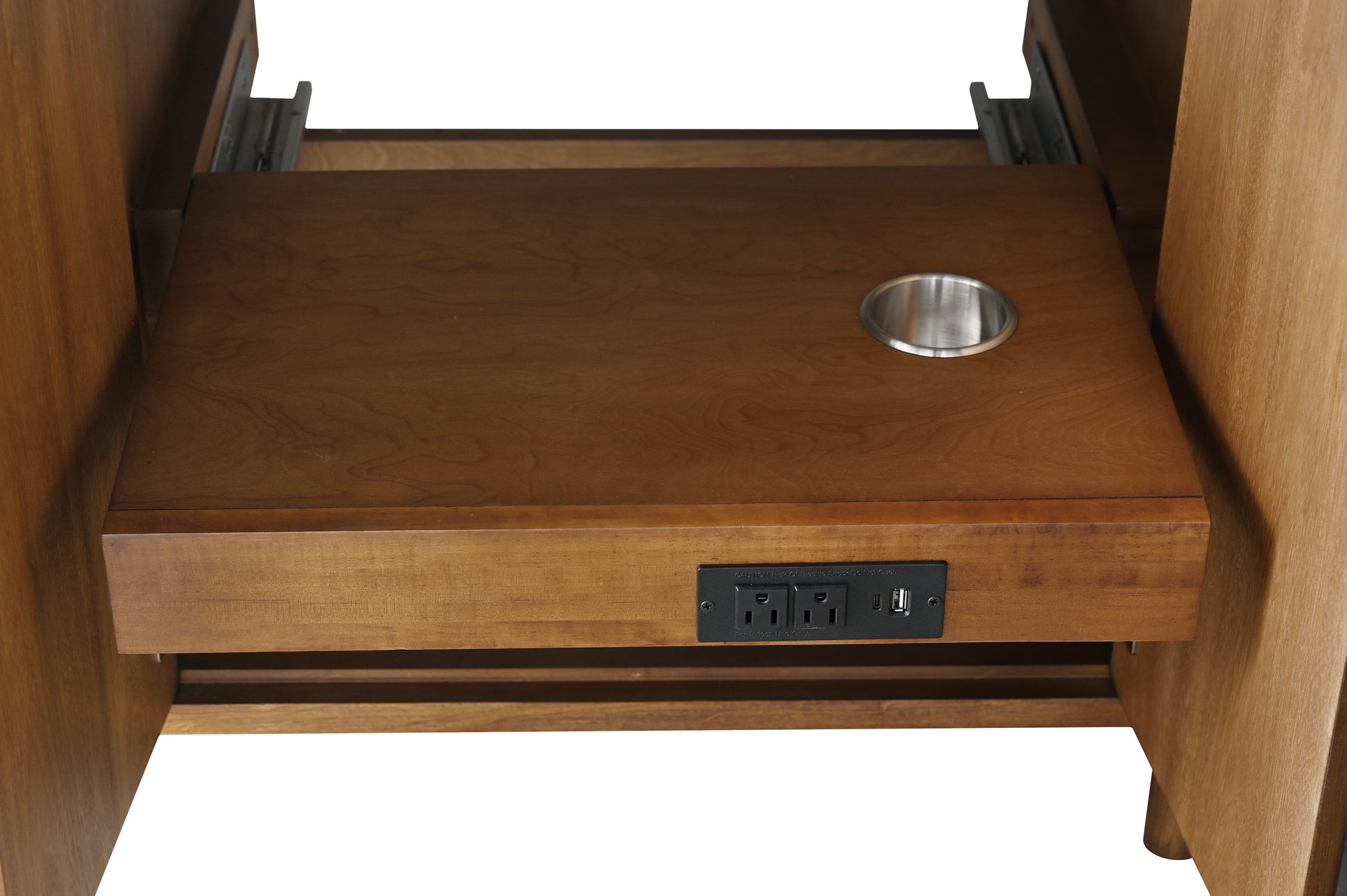 Close-up of pull-out electrical drawer tray with power outlets USB port and cable grommet hole