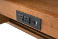 Close-up of built-in electrical outlet panel with two AC outlets USB-A and USB-C ports on vanity drawer