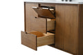 Close-up of walnut vanity open drawers with wood interiors and top tilt-out drawer detail