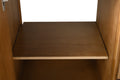 Interior adjustable shelf detail inside walnut vanity cabinet door storage compartment
