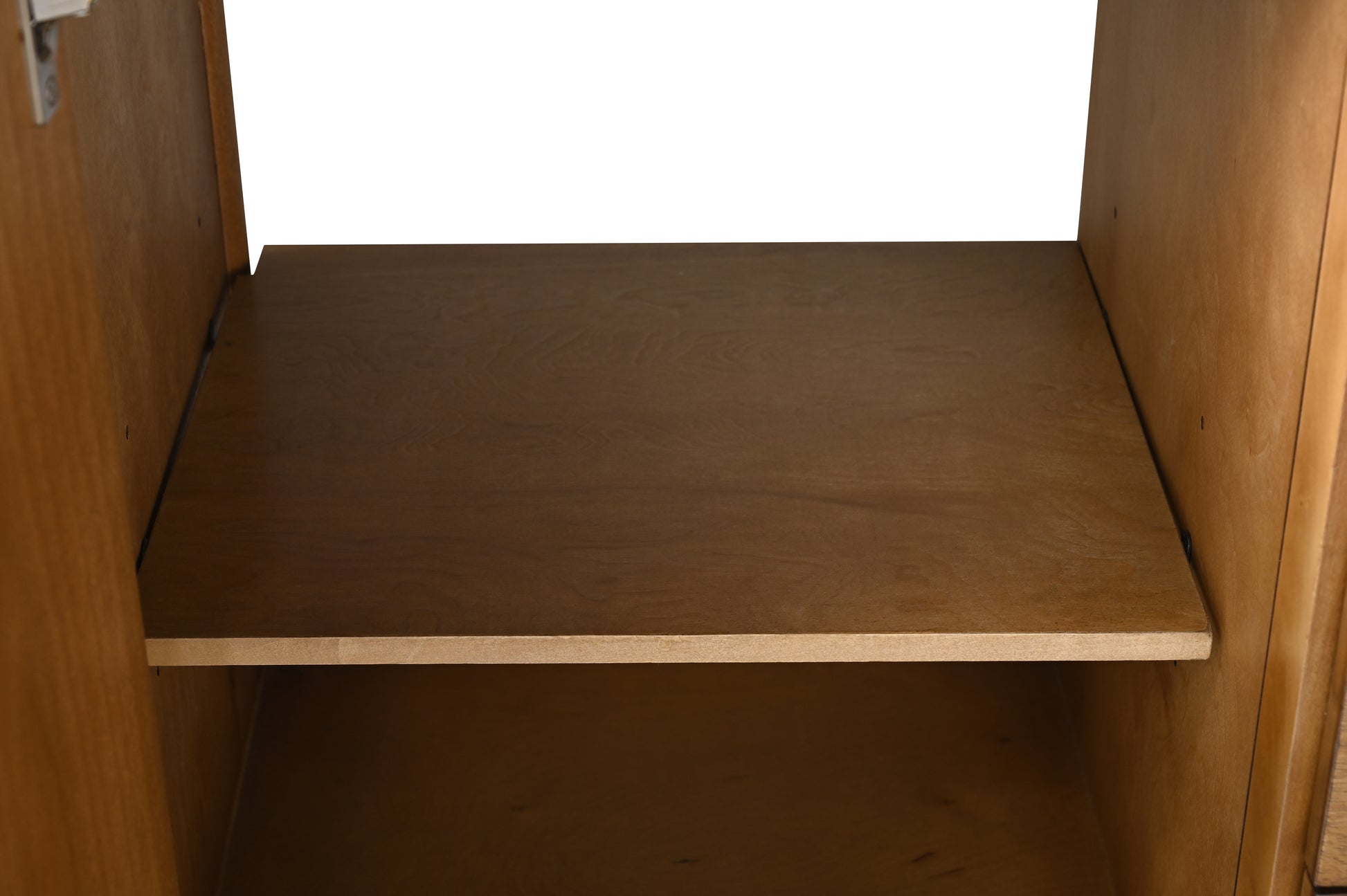 Interior adjustable shelf detail inside walnut vanity cabinet door storage compartment