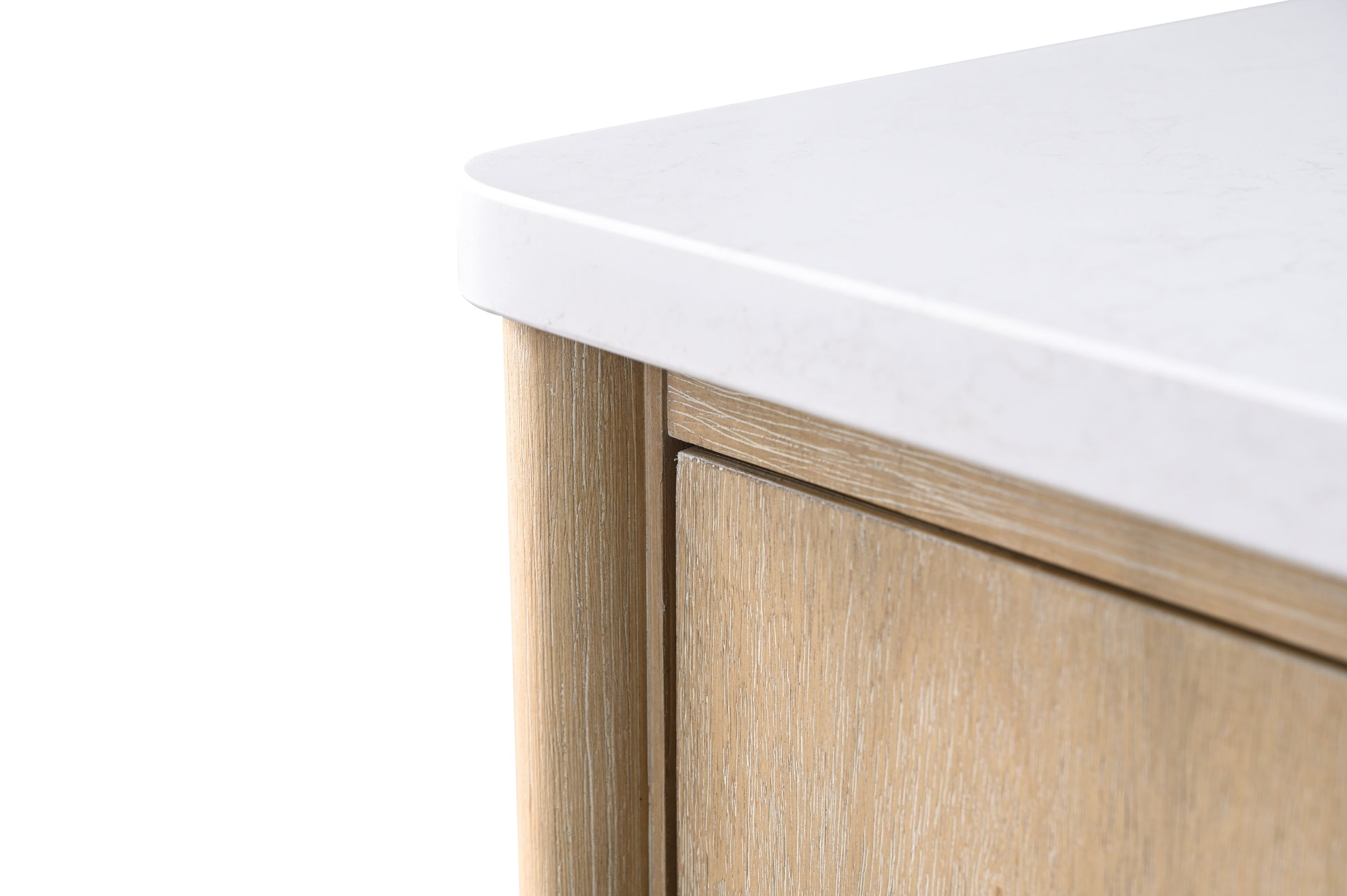 Close-up of rounded corner white engineered stone countertop edge on light oak bathroom vanity cabinet