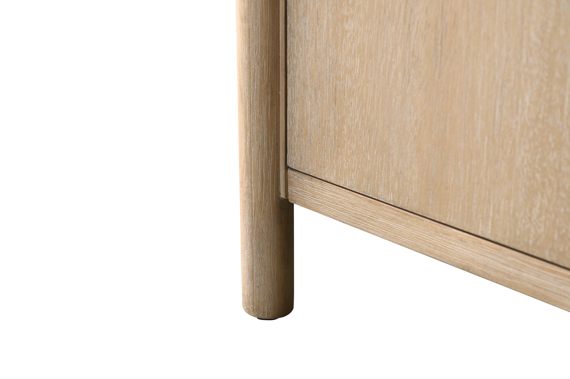 Close-up of light oak vanity cabinet leg showing rounded cylindrical wood detail and natural grain finish