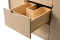 Close-up of middle drawer open on oak vanity with removable wooden divider organizer insert