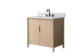 Angled front view of 36-inch light oak bathroom vanity with white stone top, double doors, and matte black faucet